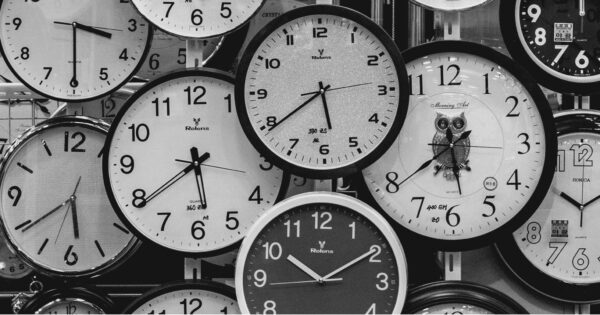 Many clock faces in balck and white