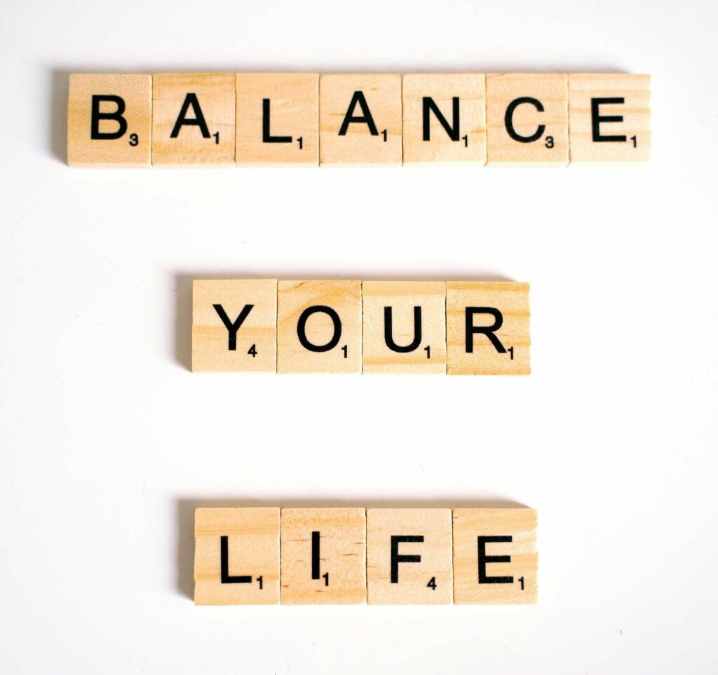 Scrabble pieces spelling "Balance your life."