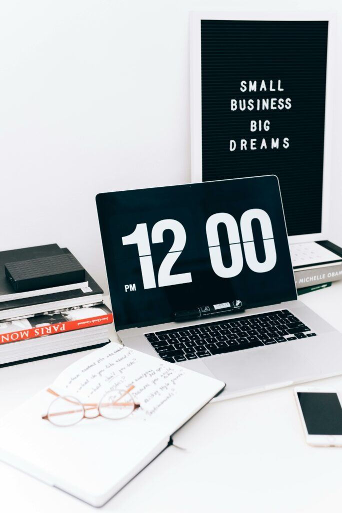 Desktop with a sign reading "SMALL BUSINESS BIG DREAMS."